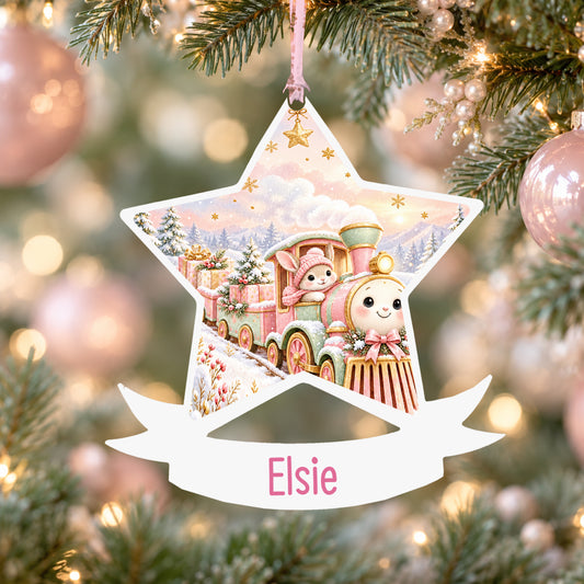 Personalised pink Christmas train acrylic star Christmas bauble with custom name, hanging on a Christmas tree with baby pink ribbon