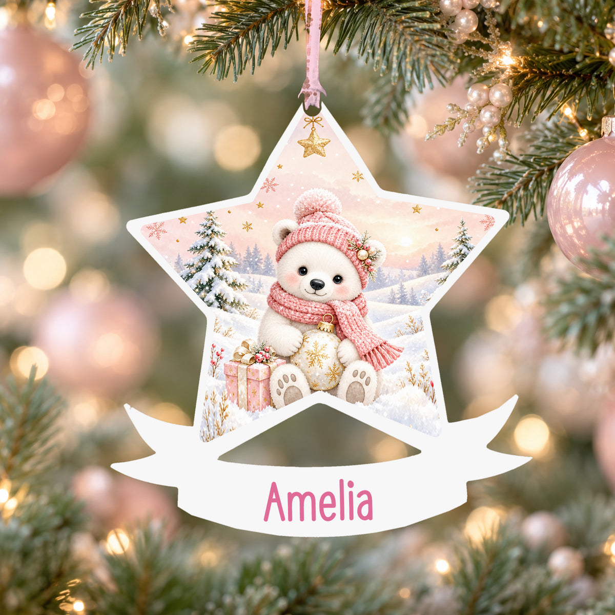 Personalised pink polar bear acrylic star Christmas bauble with custom name, hanging on a Christmas tree with baby pink ribbon