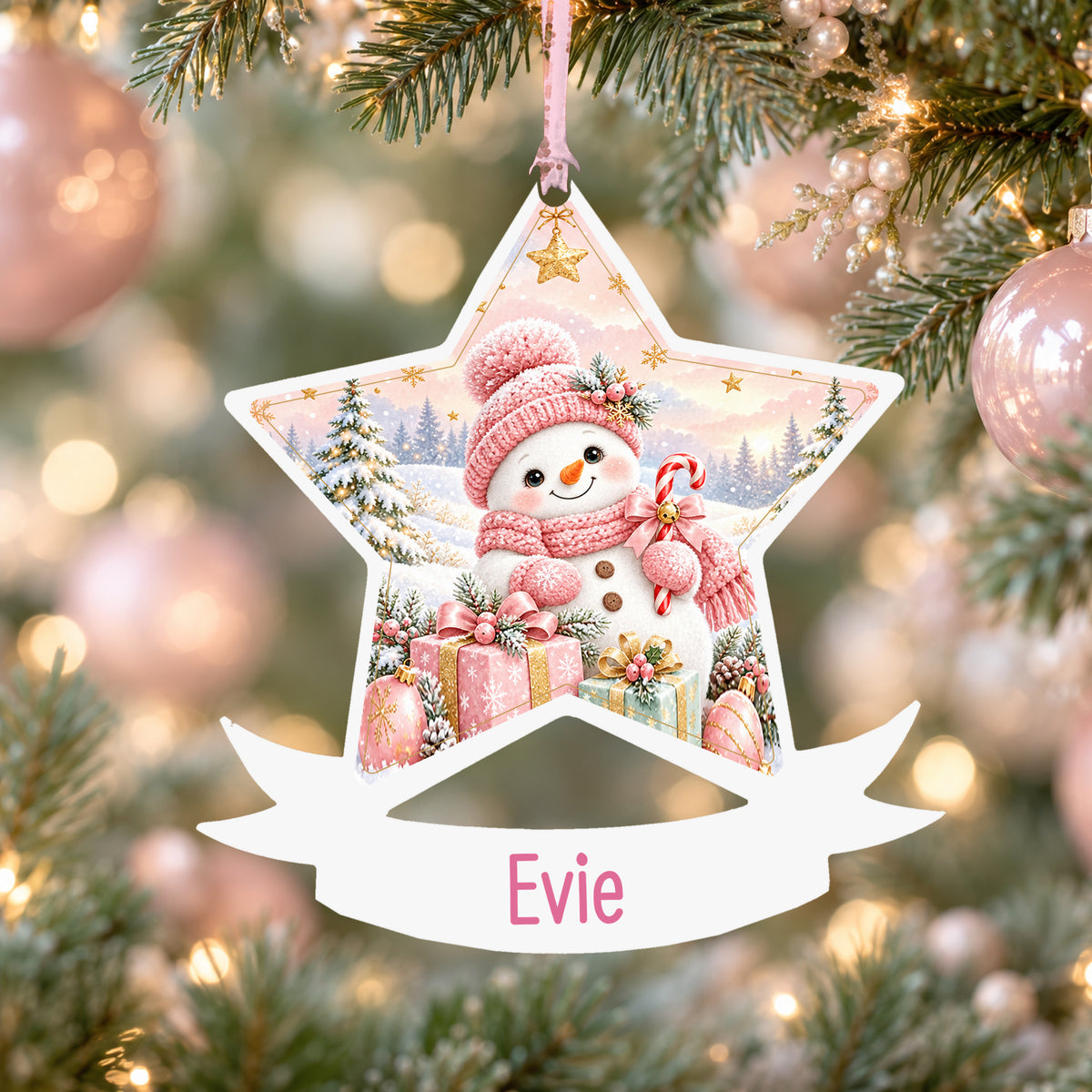Personalised pink snowman acrylic star Christmas bauble with custom name, hanging on a Christmas tree with baby pink ribbon