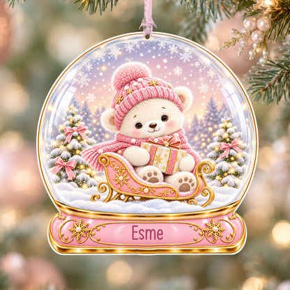 Personalised pink teddy sleigh acrylic snow globe Christmas bauble with custom name, hanging on a Christmas tree with baby pink ribbon