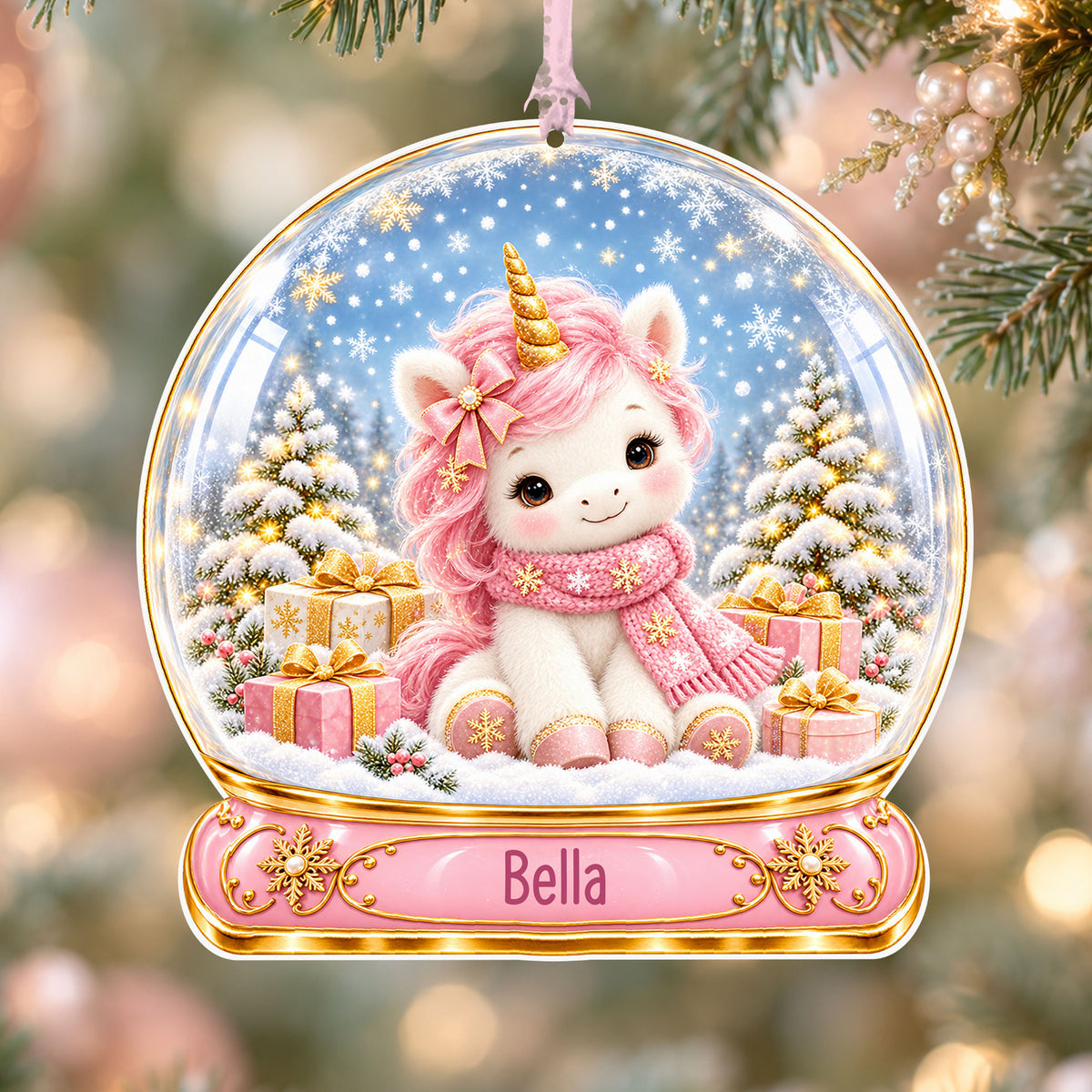 Personalised pink unicorn acrylic snow globe Christmas bauble with custom name, hanging on a Christmas tree with baby pink ribbon