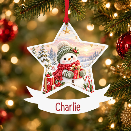 Personalised red and green snowman acrylic star Christmas bauble with custom name, hanging on a Christmas tree with red ribbon