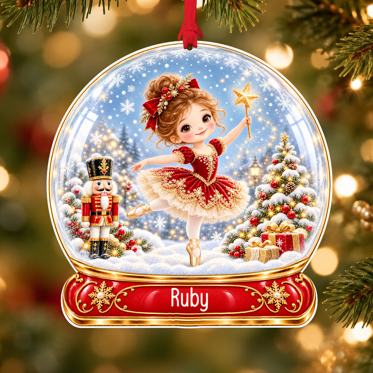 Personalised red ballerina acrylic snow globe Christmas bauble with custom name, hanging on a Christmas tree with red ribbon