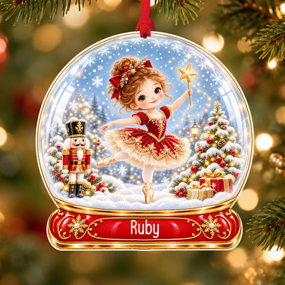 Personalised red ballerina acrylic snow globe Christmas bauble with custom name, hanging on a Christmas tree with red ribbon