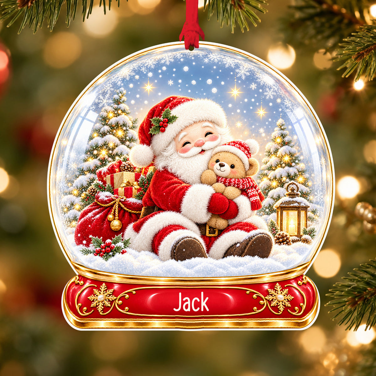 Personalised Santa and teddy acrylic snow globe Christmas bauble with custom name, hanging on a Christmas tree with red ribbon