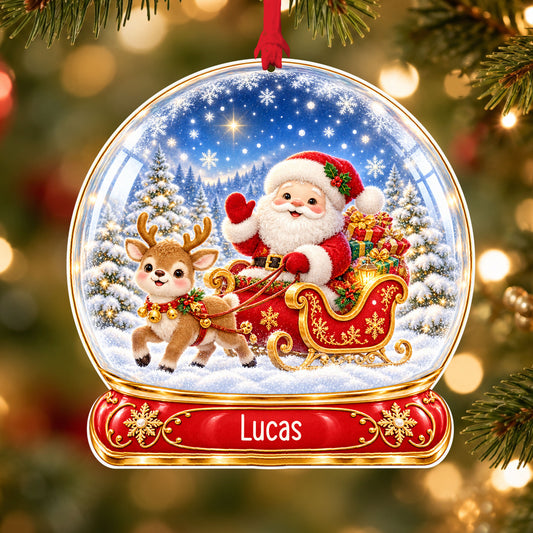 Personalised Santa sleigh acrylic snow globe Christmas bauble with custom name, hanging on a Christmas tree with red ribbon