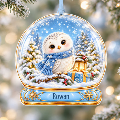 Personalised snowy owl acrylic snow globe Christmas bauble with custom name, hanging on a Christmas tree with baby blue ribbon