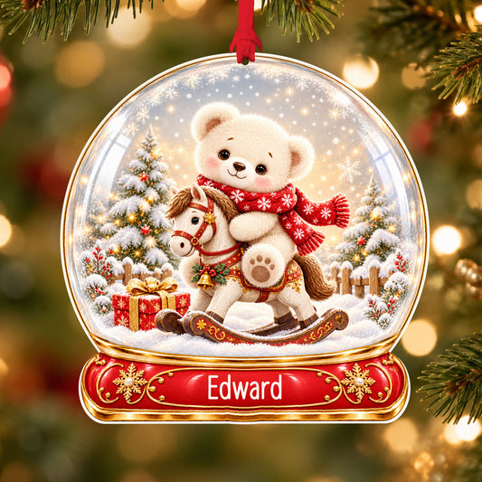 Personalised teddy on rocking horse acrylic snow globe Christmas bauble with custom name, hanging on a Christmas tree with red ribbon