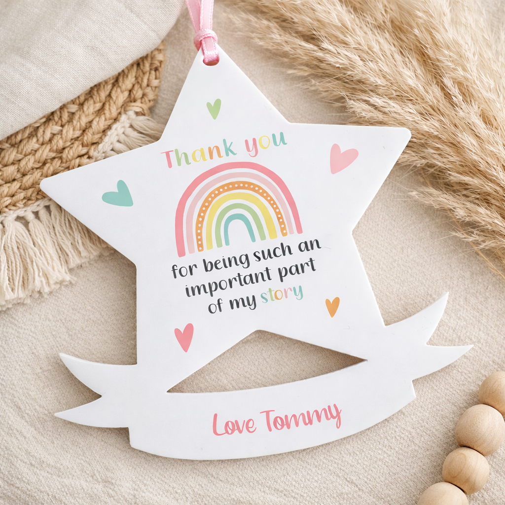 Star-shaped acrylic plaque personalised with a child's name and year, designed to hang as a keepsake