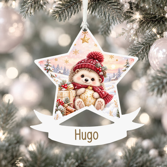 Personalised winter hedgehog acrylic star Christmas bauble with custom name, hanging on a Christmas tree with white ribbon