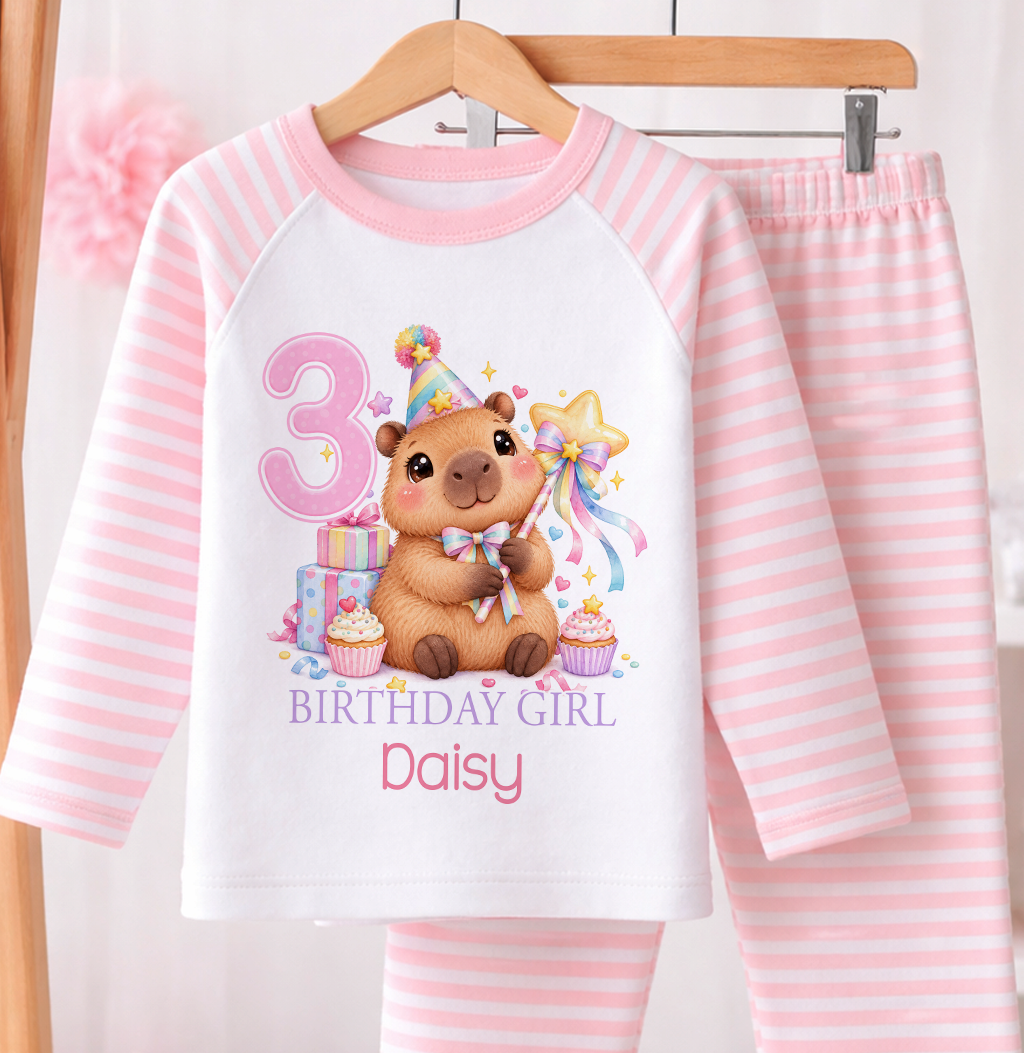 Personalised birthday girl pyjamas, Capybara Magic Wand design with name and age, pink and white stripe