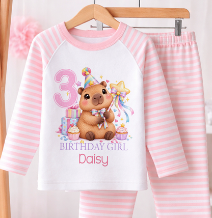 Personalised birthday girl pyjamas, Capybara Magic Wand design with name and age, pink and white stripe