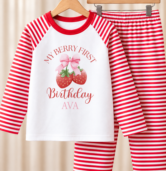 Personalised red and white striped baby pyjamas with My Berry First Birthday strawberry design and a custom name printed on the front