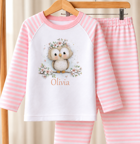 Personalised pink and white striped kids pyjamas with owl flower crown design and a custom name printed on the front