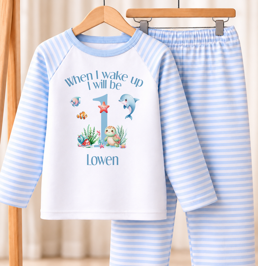 Personalised blue and white striped kids birthday pyjamas with When I Wake Up I Will Be under the sea design, name and age printed on the front