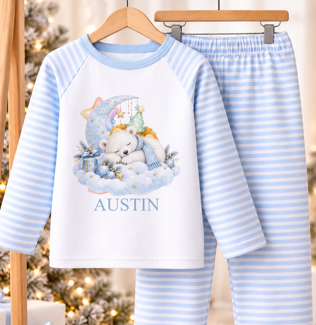 Personalised blue and white striped kids Christmas pyjamas with Sleepy Polar Bear design and a custom name printed on the front