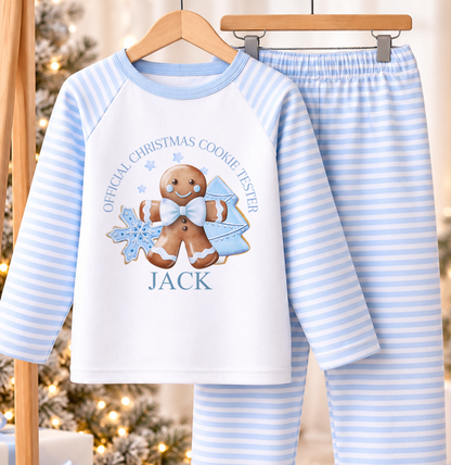 Personalised blue and white striped kids Christmas pyjamas with Blue Cookie Tester design and a custom name printed on the front