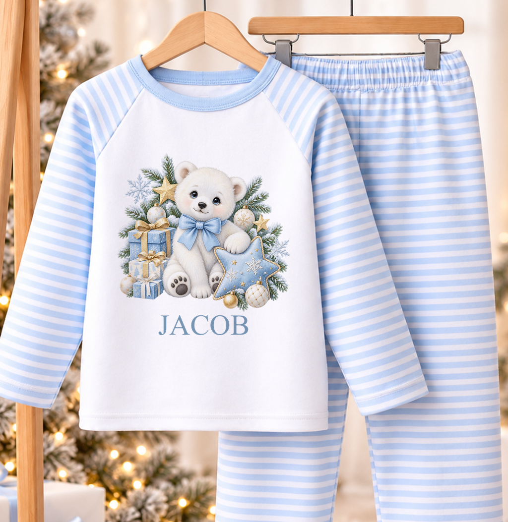 Personalised blue and white striped kids Christmas pyjamas with Polar Bear Blue Bow design and a custom name printed on the front