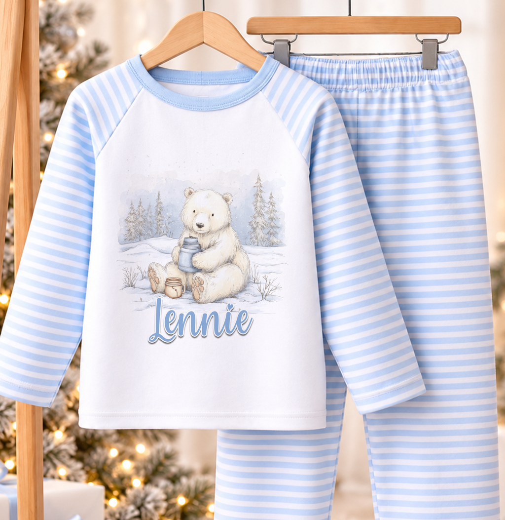 Personalised blue and white striped kids Christmas pyjamas with Snowy Polar Bear design and a custom name printed on the front