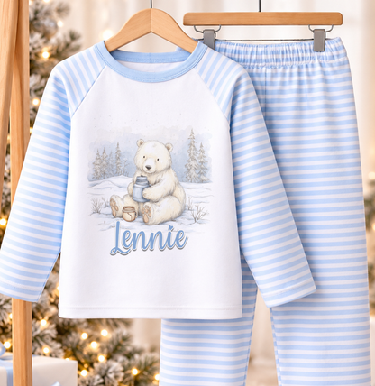 Personalised blue and white striped kids Christmas pyjamas with Snowy Polar Bear design and a custom name printed on the front