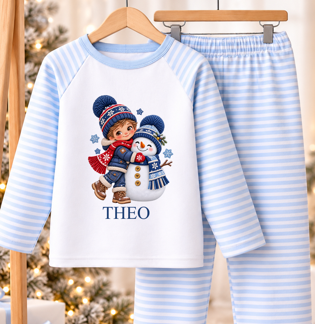 Personalised blue and white striped kids Christmas pyjamas with Boy Hugging Snowman design and a custom name printed on the front