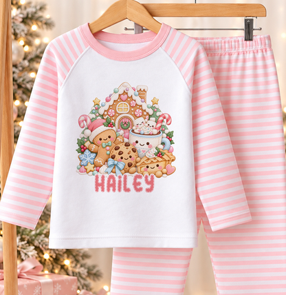 Gingerbread Treats personalised pink striped Christmas pyjamas hanging by the Christmas tree
