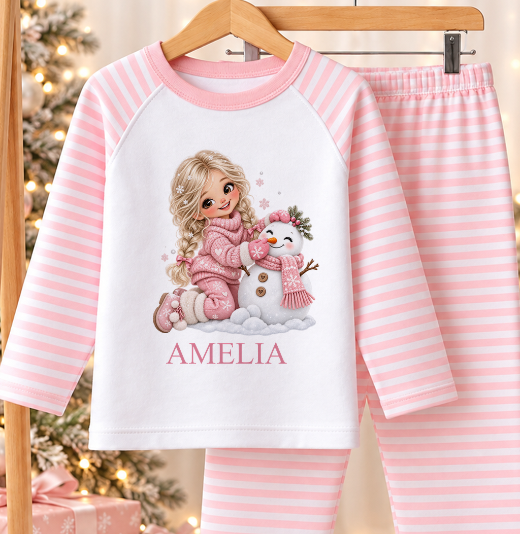 Personalised pink and white striped kids Christmas pyjamas with Blonde Girl and Snowman design and a custom name printed on the front