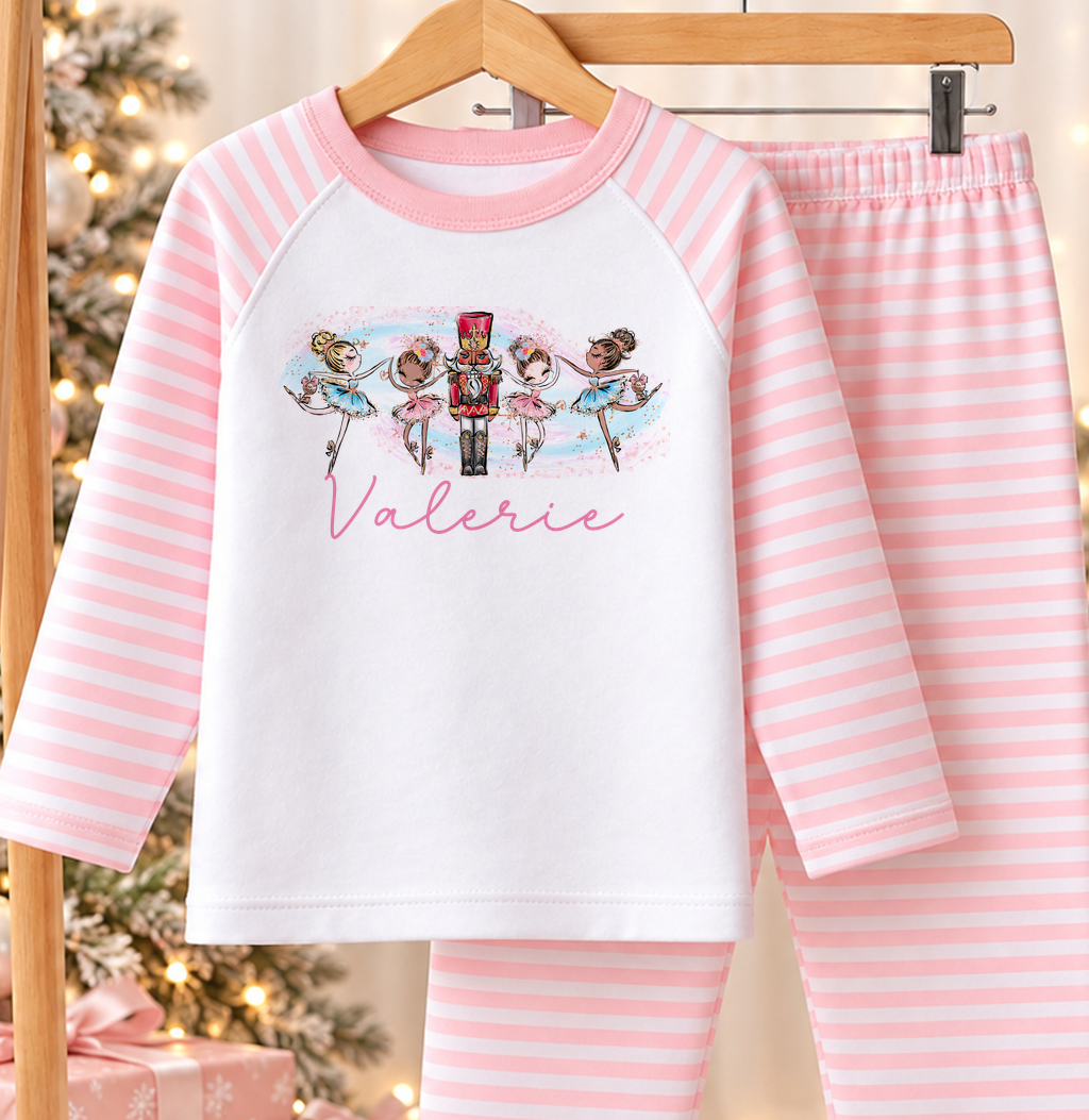 Personalised pink and white striped kids Christmas pyjamas with Ballerinas and Nutcracker design and a custom name printed on the front
