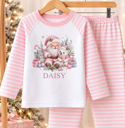 Personalised pink and white striped kids Christmas pyjamas with Pink Santa and Polar Bear design and a custom name printed on the front