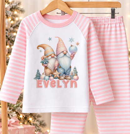 Personalised pink and white striped kids Christmas pyjamas with Pastel Christmas Gonks design and a custom name printed on the front