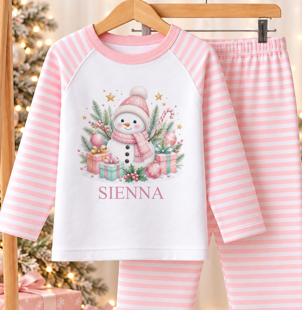 Personalised pink and white striped kids Christmas pyjamas with Pink Snowman design and a custom name printed on the front