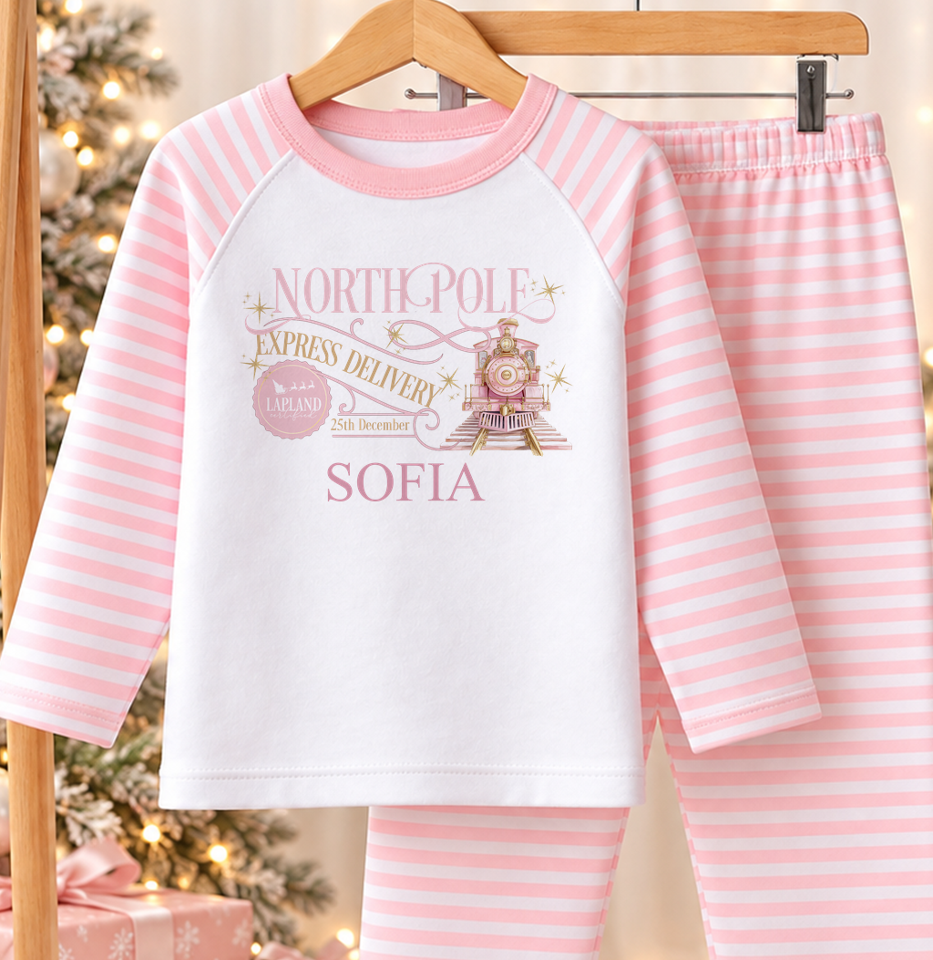 Personalised pink and white striped kids Christmas pyjamas with North Pole Express Delivery design and a custom name printed on the front