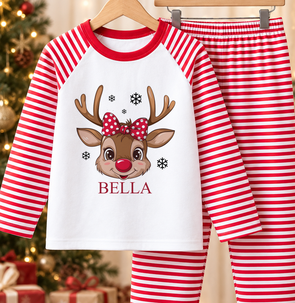 Personalised red and white striped kids Christmas pyjamas with Reindeer Face Polka Bow design and a custom name printed on the front
