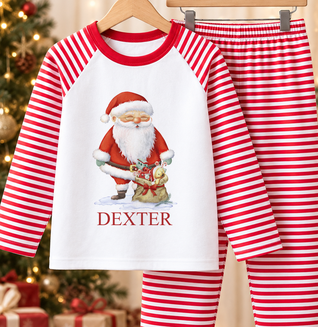 Personalised red and white striped kids Christmas pyjamas with Santa and Toy Sack design and a custom name printed on the front