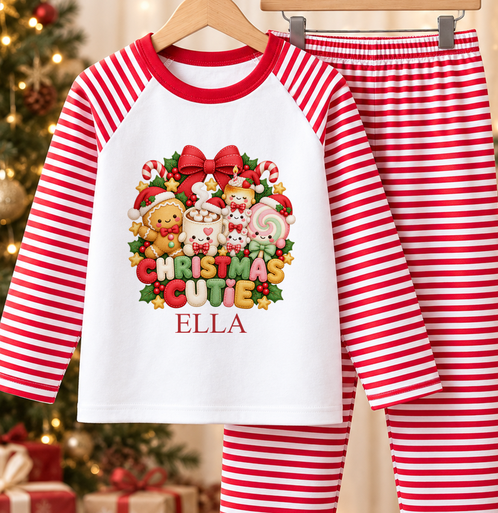 Personalised red and white striped kids Christmas pyjamas with Christmas Cutie design and a custom name printed on the front