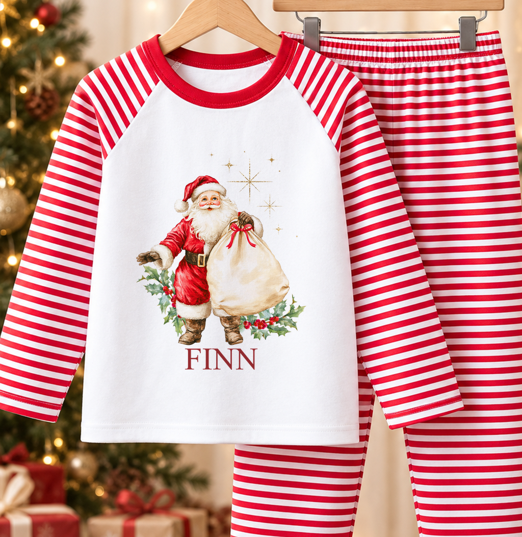 Personalised red and white striped kids Christmas pyjamas with Vintage Father Christmas design and a custom name printed on the front