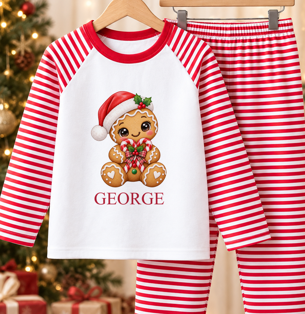 Personalised red and white striped kids Christmas pyjamas with Gingerbread Candy Cane Heart design and a custom name printed on the front