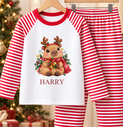 Personalised red and white striped kids Christmas pyjamas with Capybara Reindeer design and a custom name printed on the front