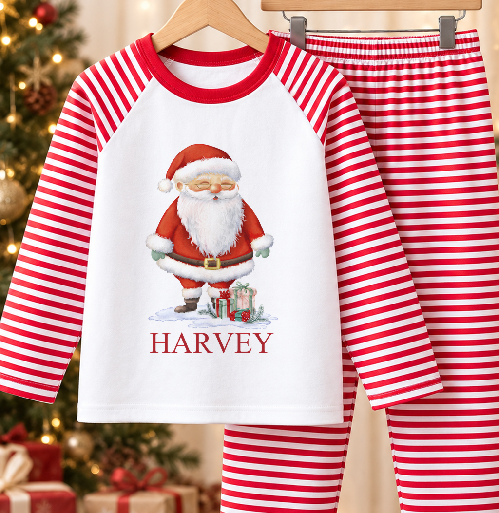Personalised red and white striped kids Christmas pyjamas with Santa with Gifts design and a custom name printed on the front