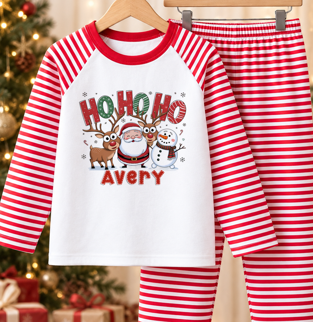 Personalised red and white striped kids Christmas pyjamas with Ho Ho Ho design and a custom name printed on the front