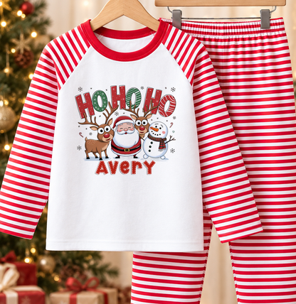 Personalised red and white striped kids Christmas pyjamas with Ho Ho Ho design and a custom name printed on the front