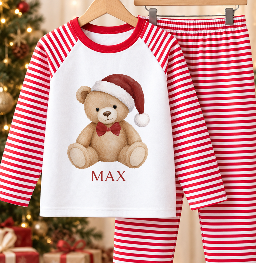 Personalised red and white striped kids Christmas pyjamas with Classic Santa Hat Teddy design and a custom name printed on the front