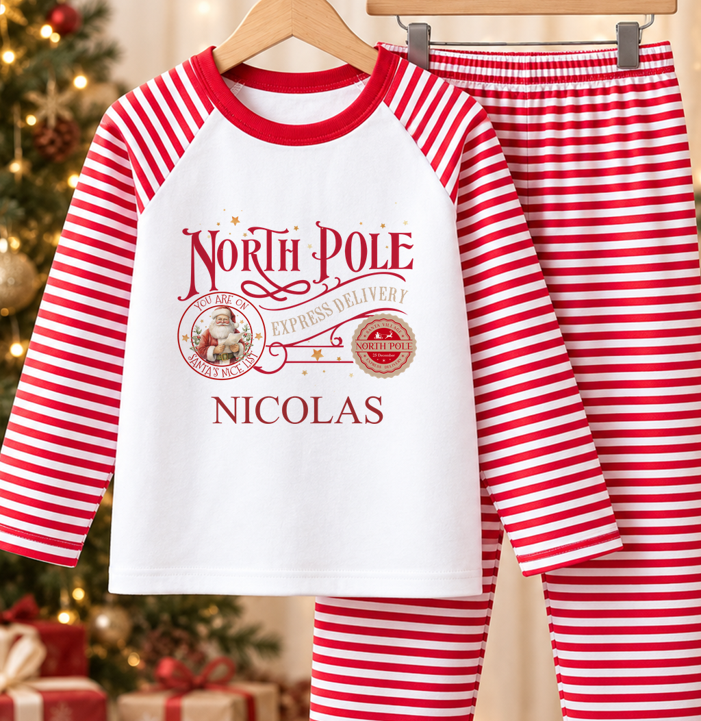 Personalised red and white striped kids Christmas pyjamas with North Pole Express Delivery design and a custom name printed on the front