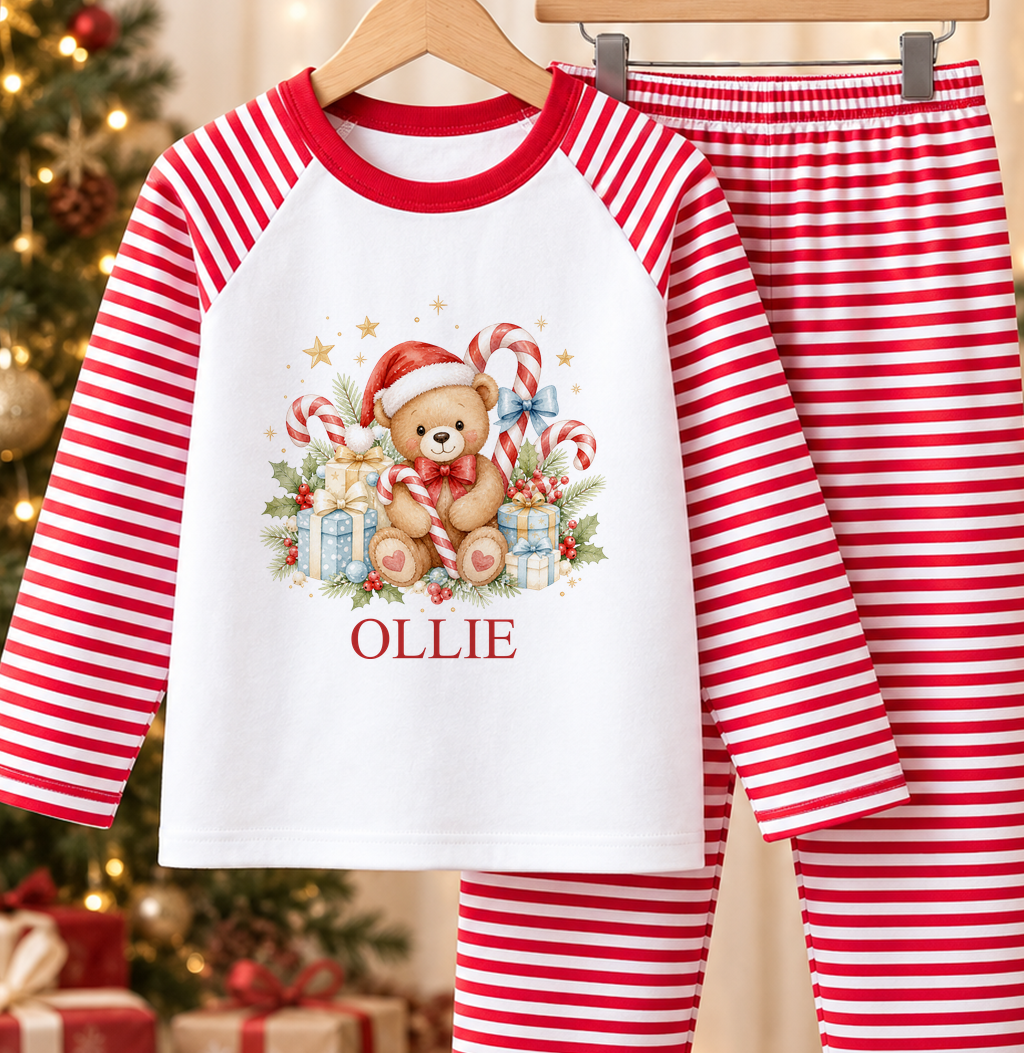 Personalised red and white striped kids Christmas pyjamas with Candy Cane Teddy design and a custom name printed on the front