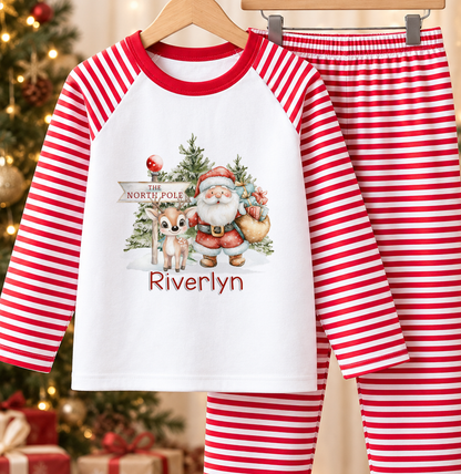 Personalised red and white striped kids Christmas pyjamas with Santa and Baby Reindeer design and a custom name printed on the front