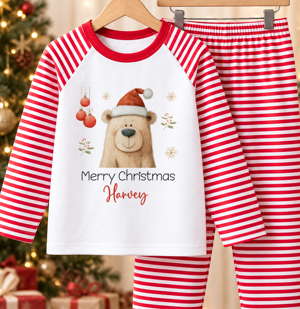 Personalised red and white striped kids Christmas pyjamas with Santa Hat Bear design and a custom name printed on the front