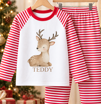 Personalised red and white striped kids Christmas pyjamas with Baby Reindeer design and a custom name printed on the front