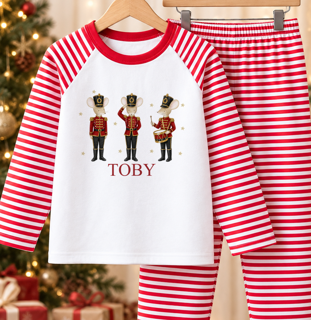 Personalised red and white striped kids Christmas pyjamas with Nutcracker Mice design and a custom name printed on the front