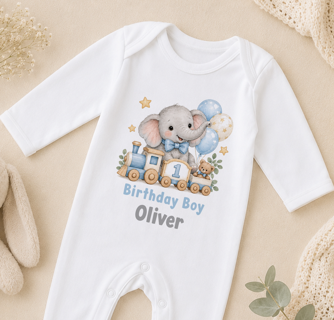Personalised elephant train first birthday sleepsuit with Birthday Boy Oliver