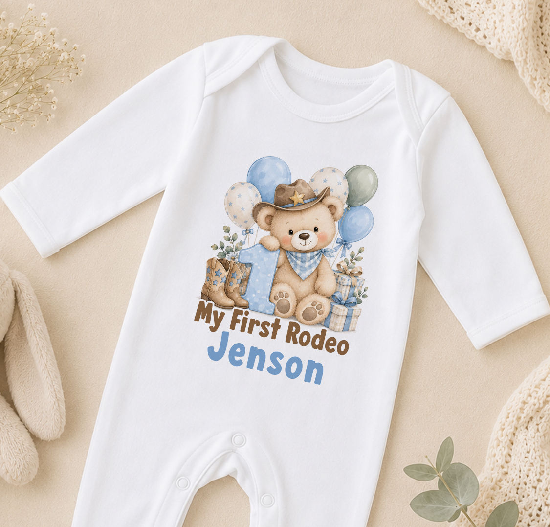 Personalised My First Rodeo first birthday sleepsuit with the name Jenson